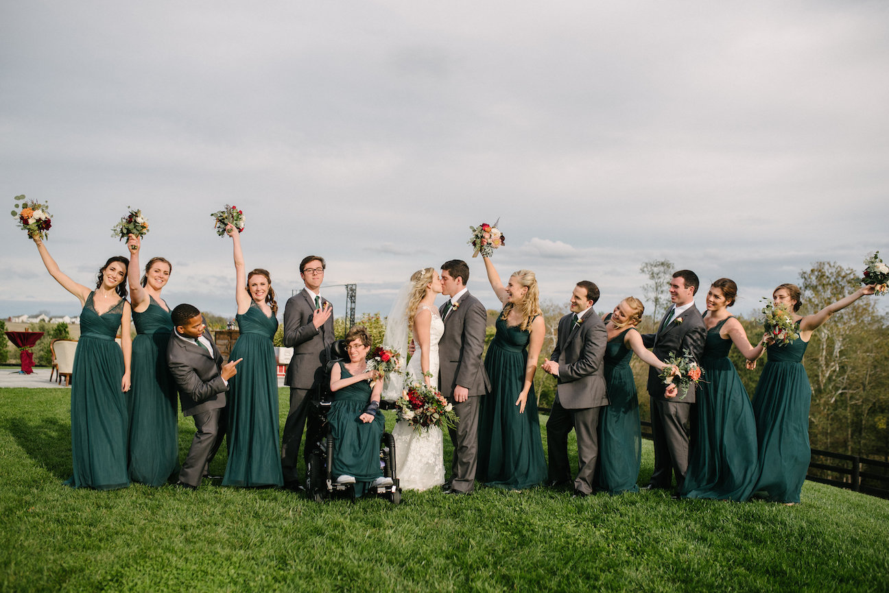 Bridal party with green bridesmaids gowns