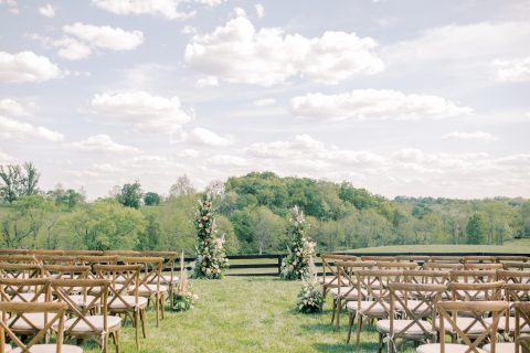 A view down the aisle at an outdoor wedding ceremony at Shadow Creek in Virginia