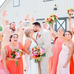 Coral bridesmaids dresses and wedding party at Shadow Creek