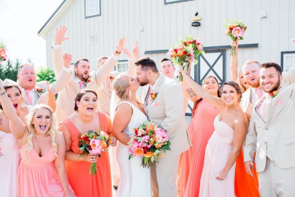 Coral bridesmaids dresses and wedding party at Shadow Creek