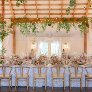 barn reception with light blue details and flowers